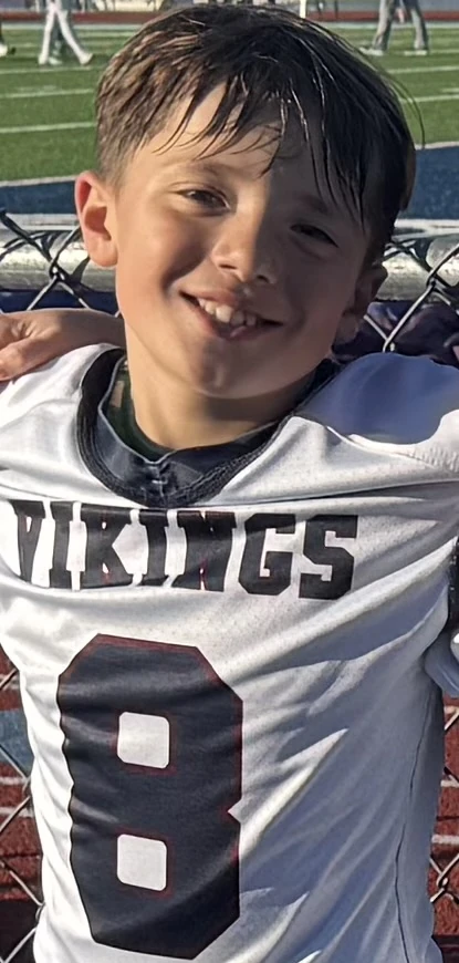 G Tucker in his number 8 Vikings football jersey